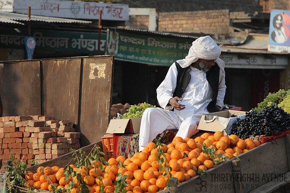 Orange Vender On Fruit Cart