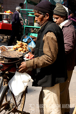 Man Making & Selling Snacks On The Street