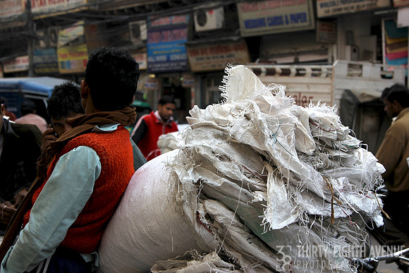 White Satchel Of White Rag Material On Back Of Bicycle