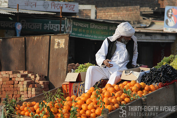 Man Selling Oranges From Cart