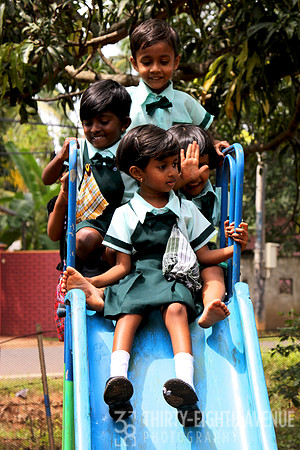 Sri Lanka School Children On Blue Slide
